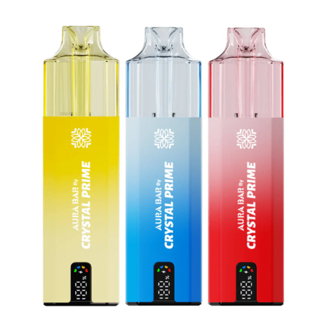 Three colorful Crystal Prime 10000 Puffs reusable vape devices in yellow, blue, and red with digital puff counters.