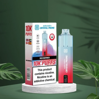 Crystal Prime 10000 Puffs reusable vape device in red berries flavor with packaging and nicotine warning label.
