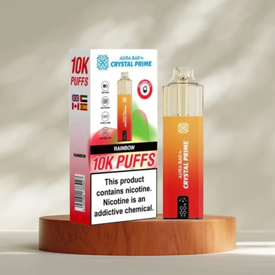 Crystal Prime 10000 Puffs reusable vape device in rainbow flavor with packaging, featuring long-lasting mesh coil technology and nicotine warning.