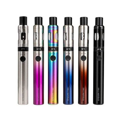 Six Innokin Endura T18E adjustable MTL vape pens in silver, pink, rainbow, blue, orange, and black colors standing upright.